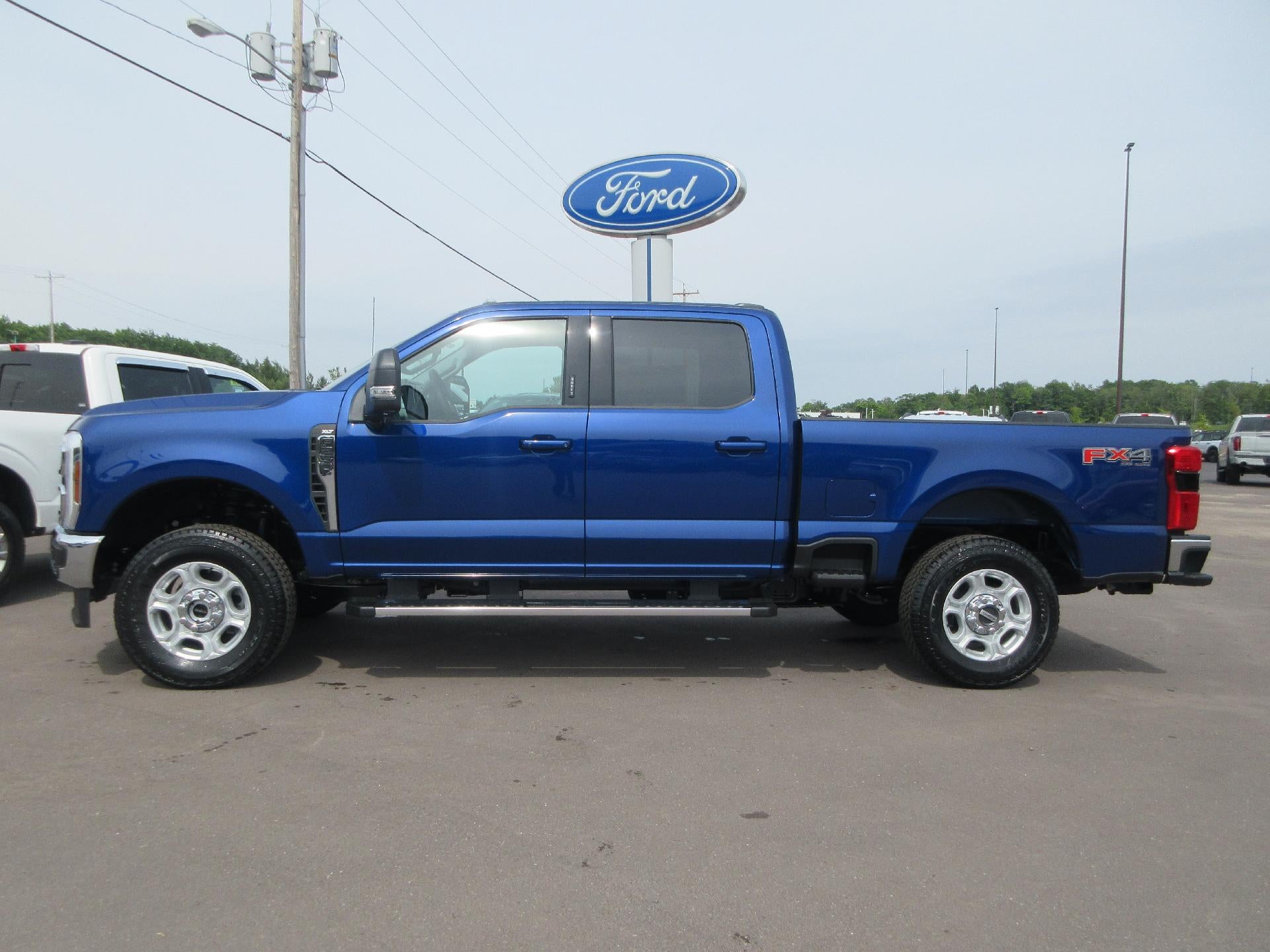 2026 Ford Super Duty F-250 SRW XL 4WD Crew Cab 6.75' Box in Argon Blue Metallic — front three-quarter view
