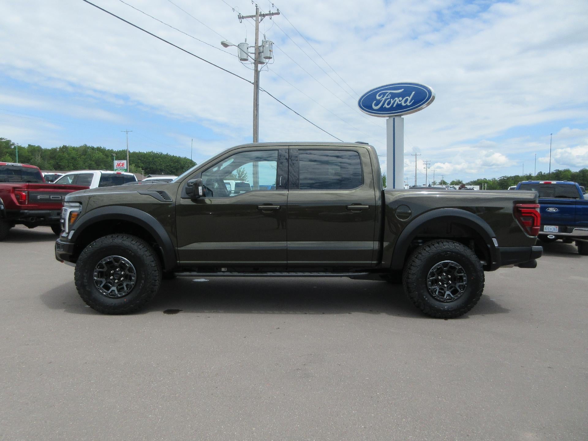 2026 Ford F-150 Raptor 4WD SuperCrew 5.5' Box in Shelter Green — front three-quarter view