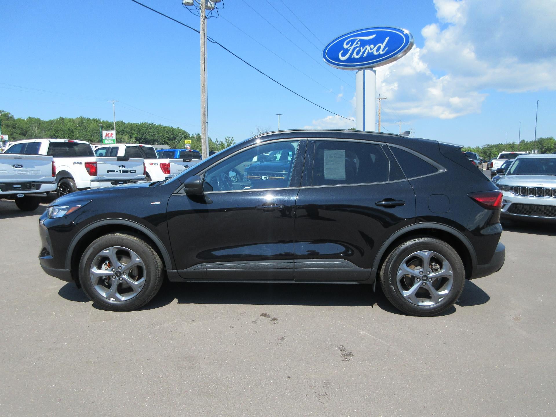 2025 Ford Escape ST-Line AWD in Agate Black Metallic — front three-quarter view