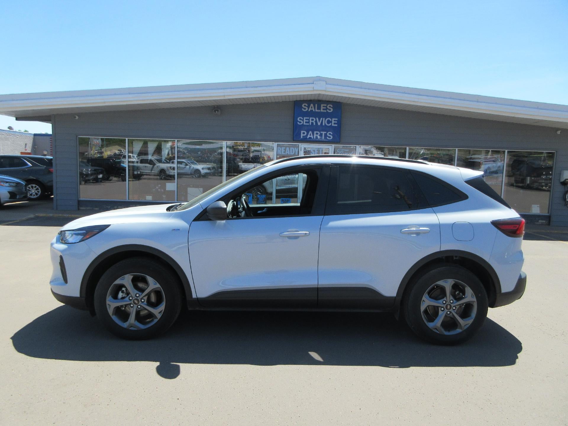 2025 Ford Escape ST-Line AWD in Star White Metallic Tri-Coat — front three-quarter view