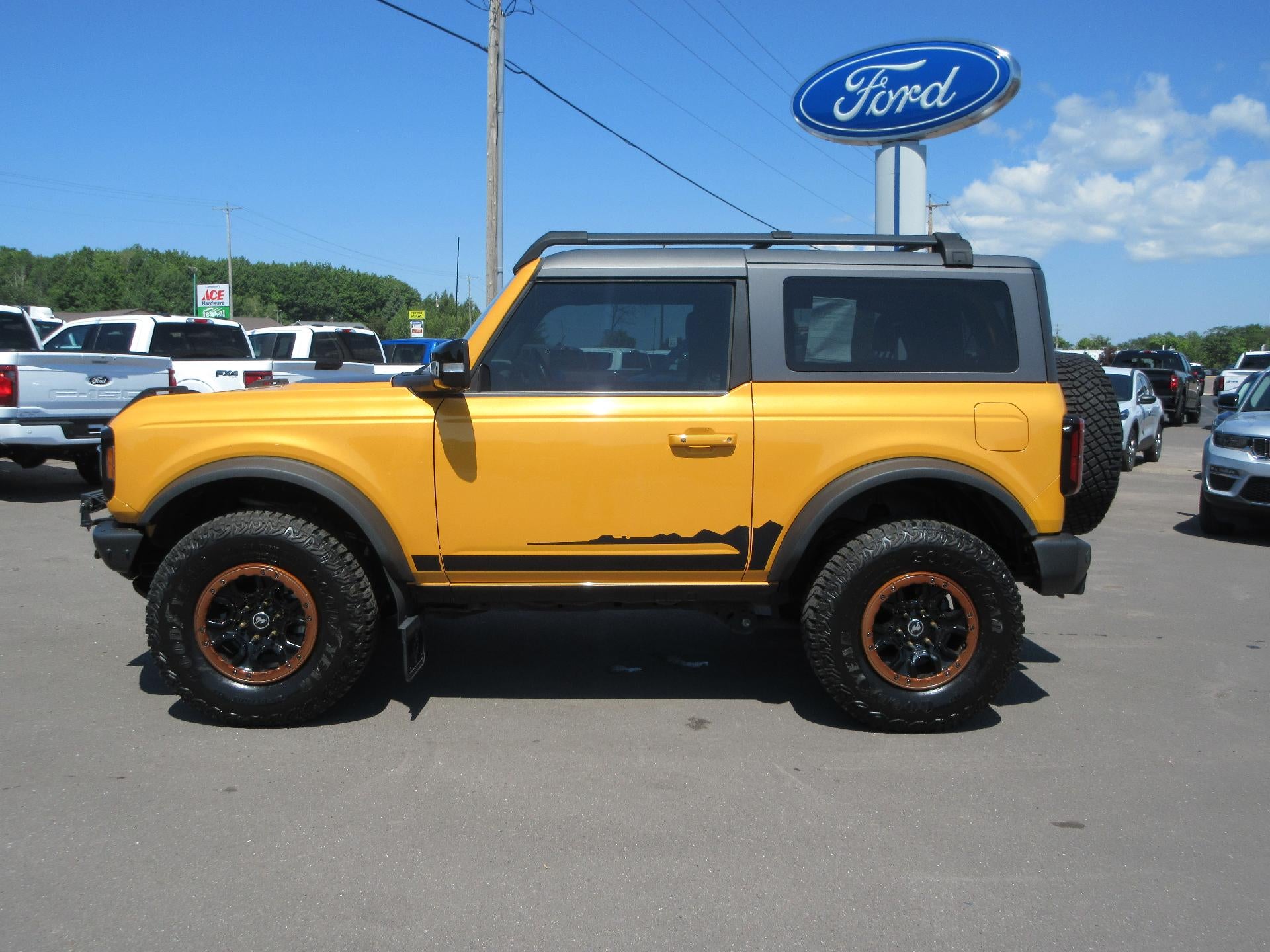2021 Ford Bronco Wildtrak 2 Door Advanced 4x4 in Cyber Orange Metallic Tricoat — front three-quarter view