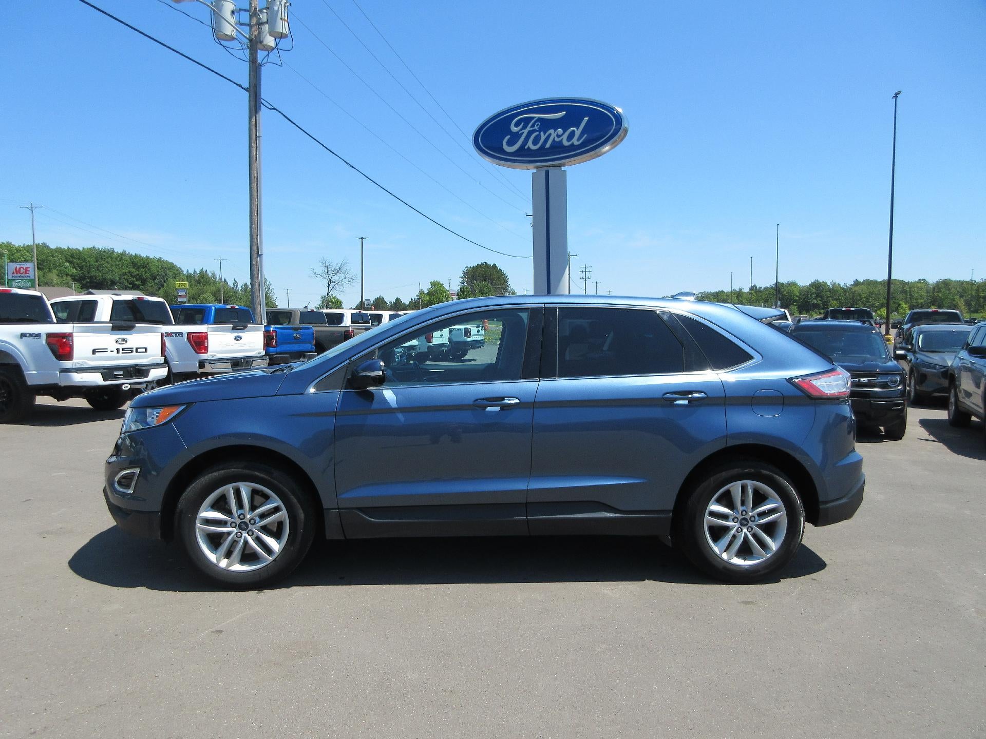 2018 Ford Edge SEL AWD in Blue — front three-quarter view