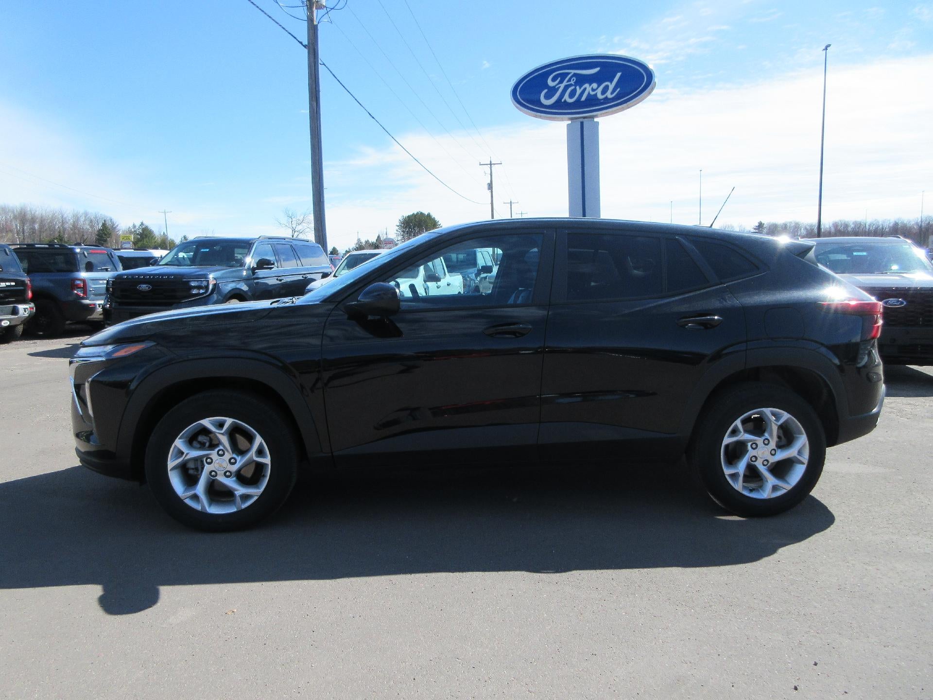 2025 Chevrolet Trax FWD 4dr LS in Mosaic Black Metallic — front three-quarter view